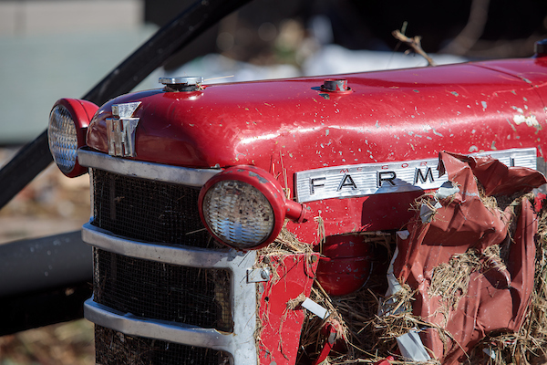 Tractor amid tornado rubble, UKREC, Princeton, KY